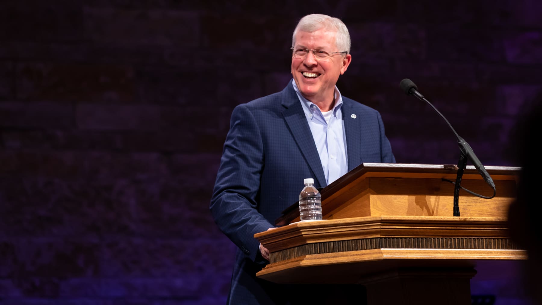 Chaplain Joe Allen at a podium